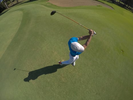 top view of golf player hitting shot photo