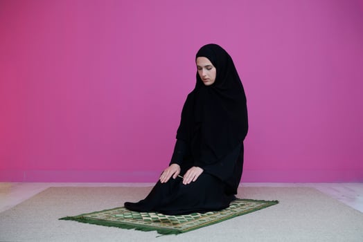 Muslim woman in namaz praying to Allah photo