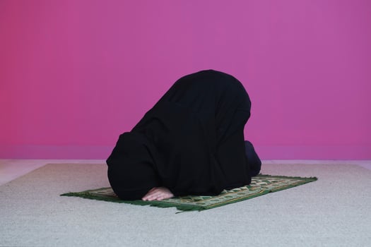 Muslim woman in namaz praying to Allah photo