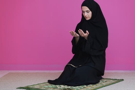 Muslim woman in namaz praying to Allah photo