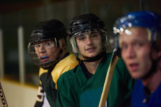 ice hockey players on bench photo