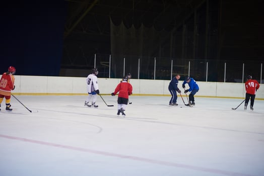 teen ice hockey players team meeting with trainer photo