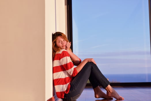 relaxed young man at home on balcony photo