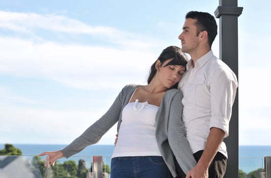 couple relaxing on balcony photo