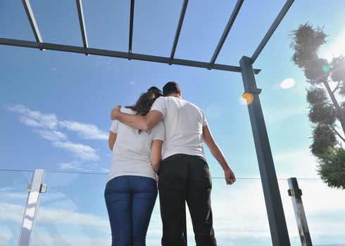 couple relaxing on balcony photo