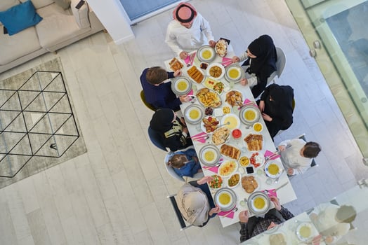 Top view of Muslim family making iftar dua to break fasting during Ramadan. photo