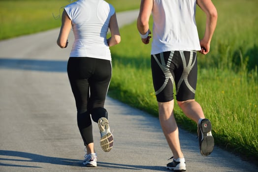 Young couple jogging at morning photo