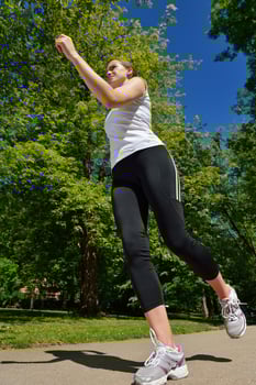 Young beautiful  woman jogging at morning in park photo