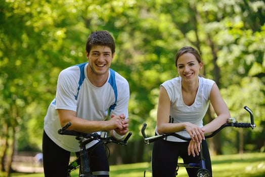 Happy couple ridine bicycle outdoors photo
