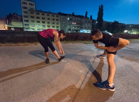 couple warming up and stretching photo