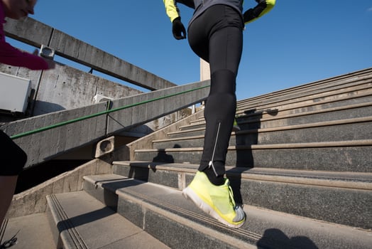 young  couple jogging on steps photo
