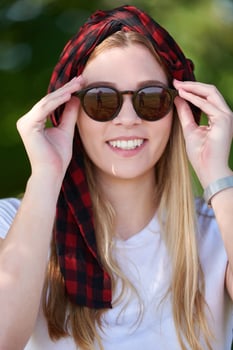 portrait of beautiful, emotional, young woman in sunglasses. photo