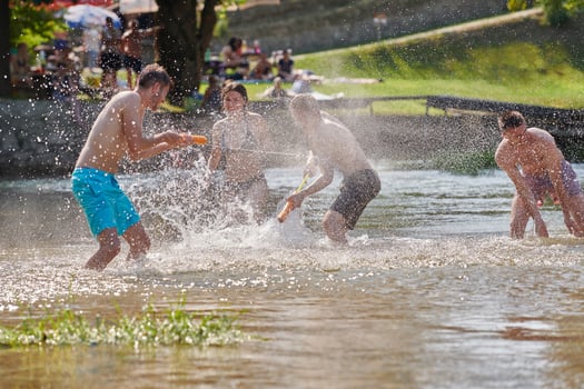group of happy friends having fun on river photo