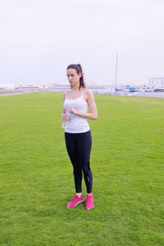 Young beautiful  woman jogging  on morning photo