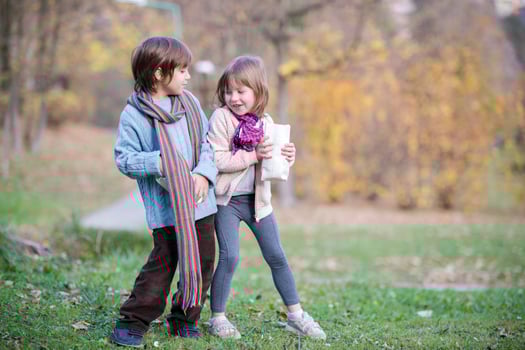 kids in park eating popcorn in park photo
