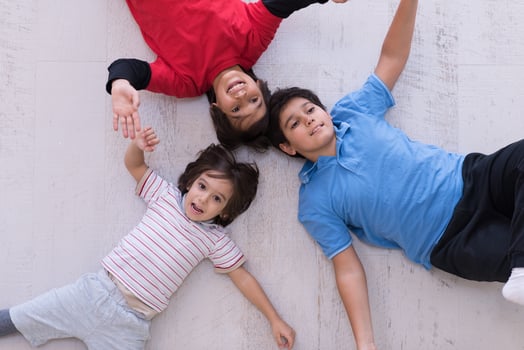 young boys having fun on the floor photo