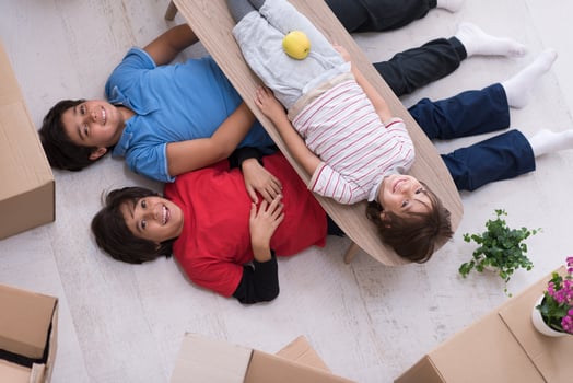 boys with cardboard boxes around them top view photo