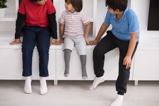 young boys posing on a shelf photo