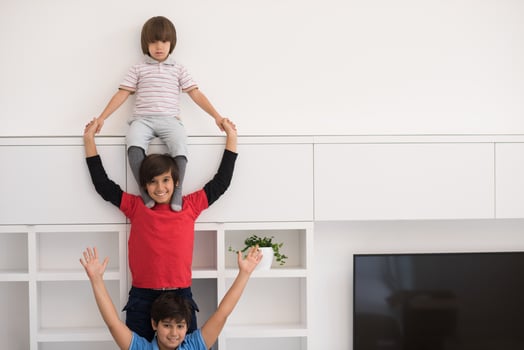 young boys posing line up piggyback photo