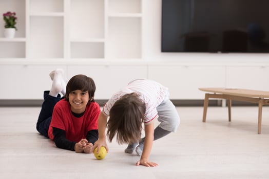 boys having fun with an apple on the floor photo