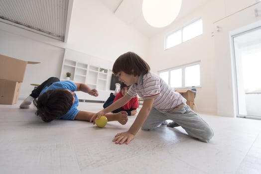 boys having fun with an apple on the floor photo