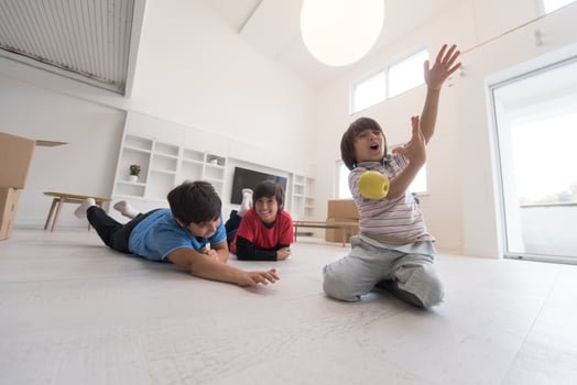 boys having fun with an apple on the floor photo