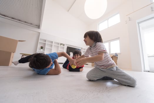 boys having fun with an apple on the floor photo