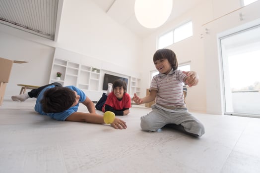 boys having fun with an apple on the floor photo