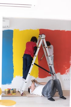 boys painting wall photo