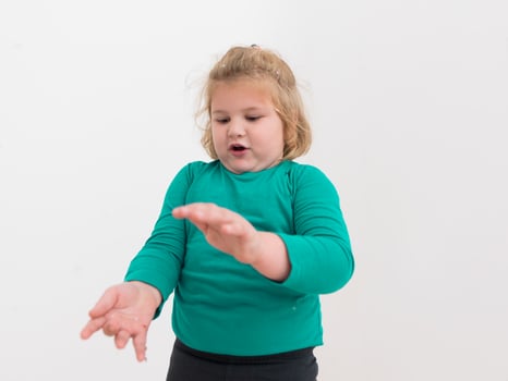 kid blowing confetti photo