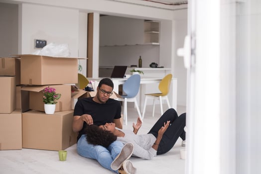 African American couple relaxing in new house photo