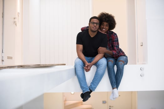 couple having break during moving to new house photo