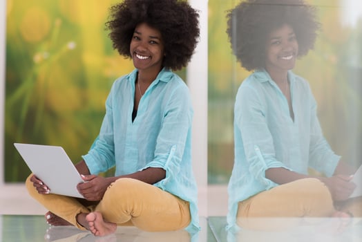 black women using laptop computer on the floor photo