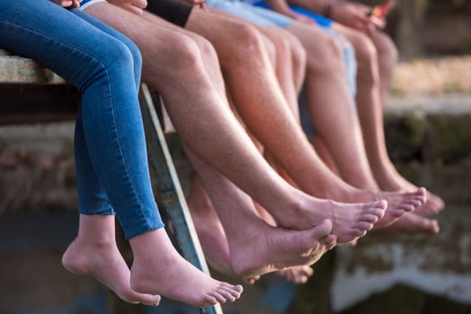 people sitting at wooden bridge photo