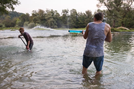 young men having fun with water guns photo