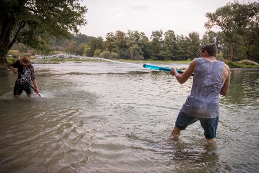 young men having fun with water guns photo