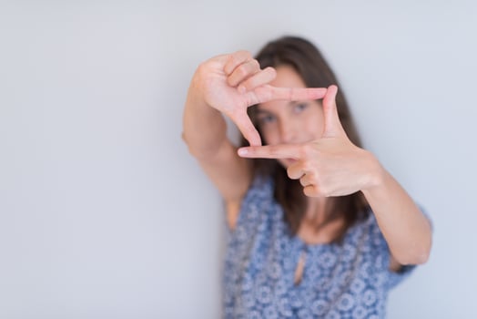 woman showing framing hand gesture photo