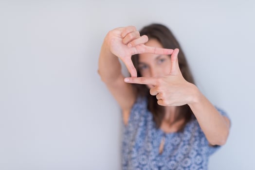 woman showing framing hand gesture photo