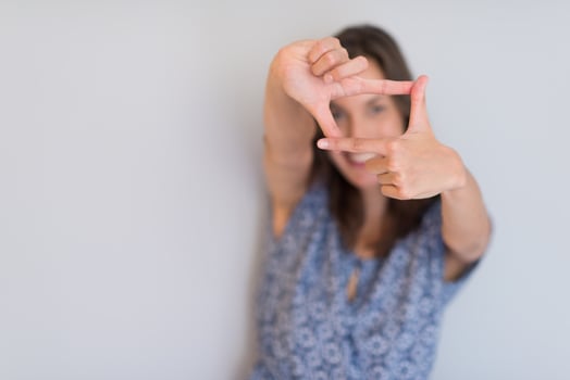 woman showing framing hand gesture photo