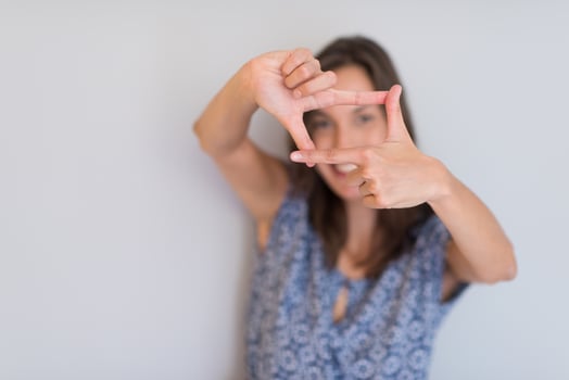woman showing framing hand gesture photo
