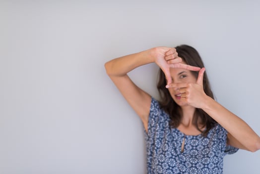 woman showing framing hand gesture photo