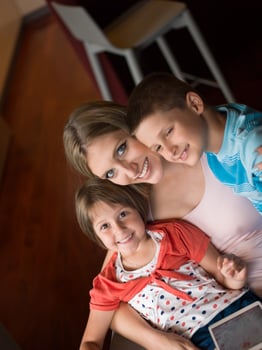 Young Family Using A Tablet To Make Future Plans photo