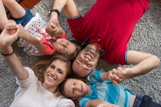 happy family lying on the floor photo