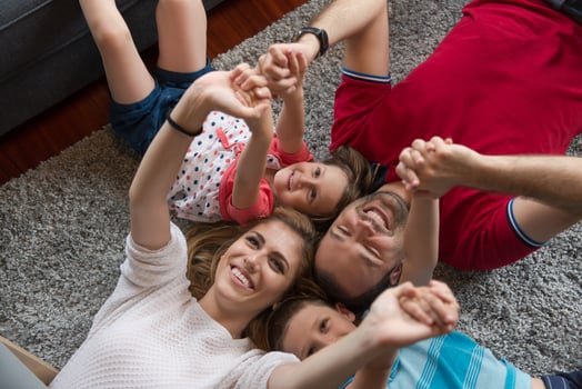 happy family lying on the floor photo