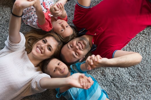 happy family lying on the floor photo