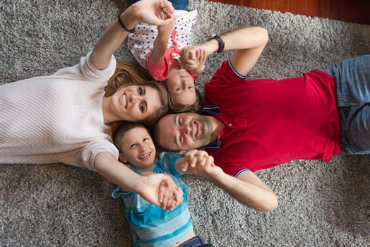 happy family lying on the floor photo