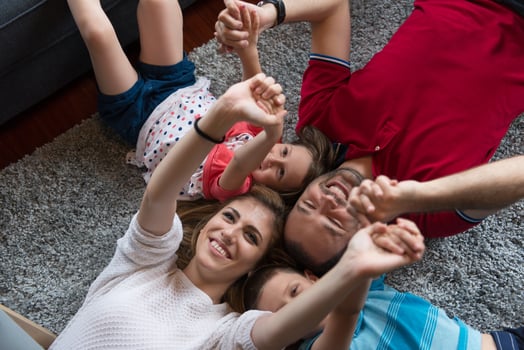 happy family lying on the floor photo