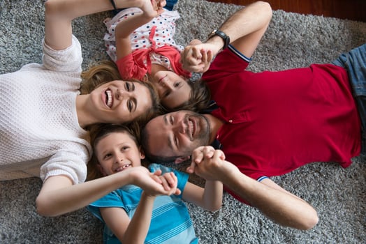 happy family lying on the floor photo
