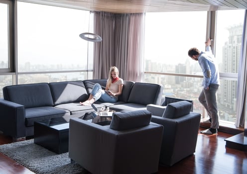 couple relaxing at  home using tablet computer photo