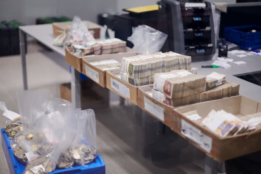 Carton boxes filled with sorted money photo